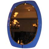 An Oval Wall Mirror in the Style of Fontana Arte