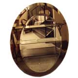 An Oval Two Tone Wall Mirror in the style of Fontana Arte