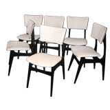 A Set of Fourteen Dining Chairs in Black Lacquer