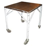 Painted metal industrial work table on wheels