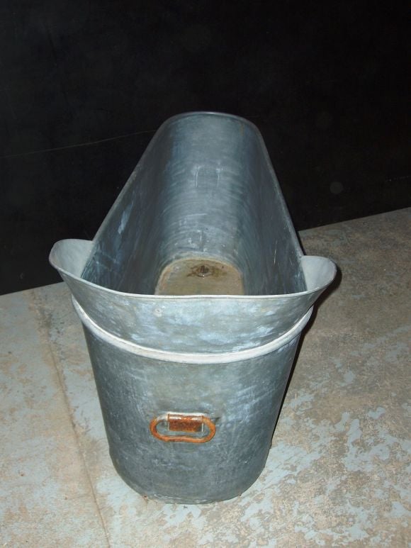 Zinc bathtub with drain and outside handle. The depth on the thinner end is 10
