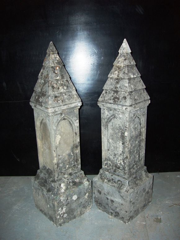 Very dramatic and rare set of 4 matching stone finials. Decorative pyramid tops. The stone is covered in live spores that add to the aged patina. Priced per pair.