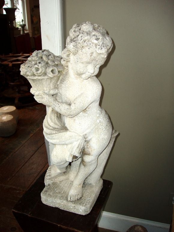 Wonderful stone cherub statue with moss and spores throughout the stone. 9x9 base.
