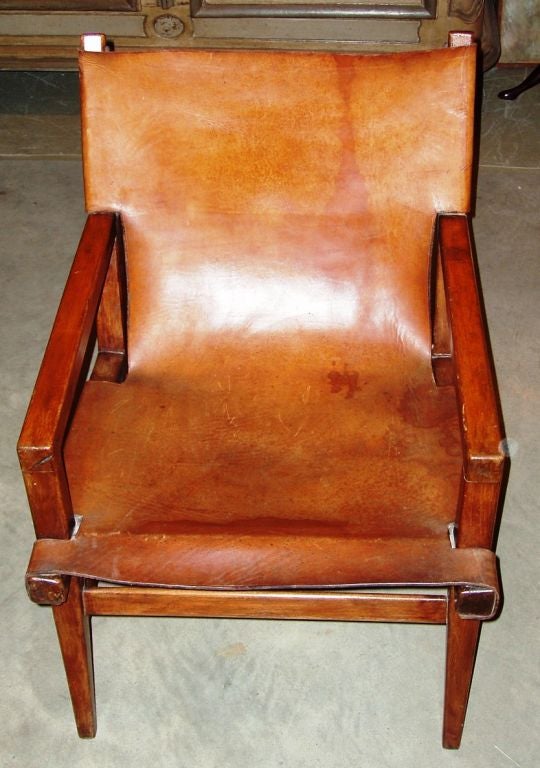 Wonderful pair of pull up chairs covered in the original leather. Extremely comfortable.