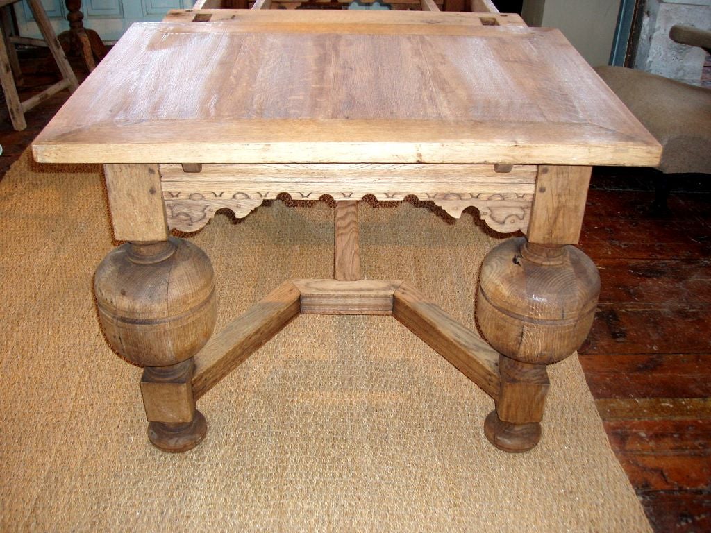 Ornate bleached Jacobean table with extensions. The table expands from 63