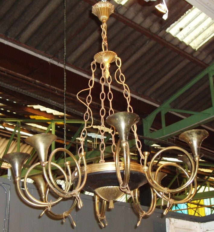 1940s, French unusual brass chandelier with eight horn shape arms.