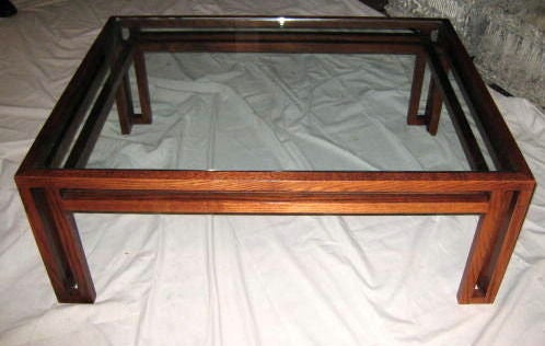 Glass top coffee table with double frame details.<br />
Very clean lines in the style of 