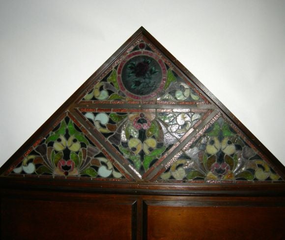 Always wanted a great stained glass window in the bedroom? This should fill the bill, as it reverse lights, creating a warm and romantic ambiance. The wood is a dark stained mahogany, and will accomodate even a king size bed, as it measures six feet