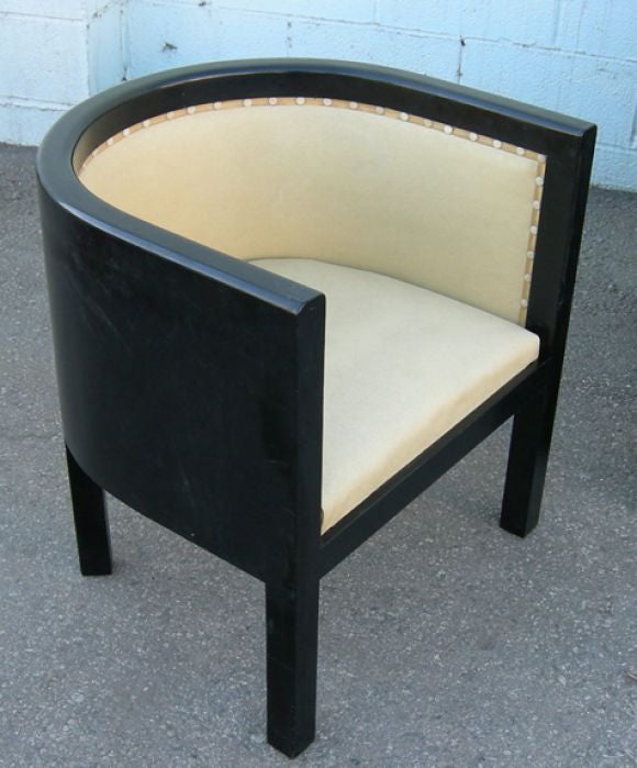 This lovely petite set bridges the styles between Arts and Crafts and the Art Deco movement. The black satin finished woods are in fine original condition, with understated detailing. The seats are in an original leatherette, which may be upgraded