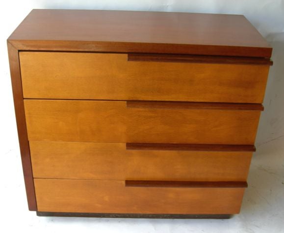 One of the classic 1930's designs, this stylish dresser was in the line created for the Herman Miller Furniture Co.The rollover walnut top nicely balances the opposite offset drawer pulls. Ours is in original finish, showing natural patina. It <br