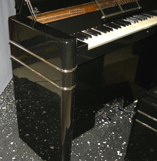 What a little cutie! These ultra stylized pianos were used in staterooms on ocean liners, if you requested a room with piano. The petite scale and great lines make them the perfect fit for any space challenged Moderne interior today. The cabinet has