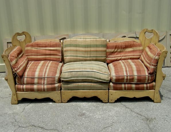 What a charmer! This lovely set includes the three piece sofa, as well as the coffee table. It obviously needs re-upholstery, as these are the original cushions, dated 1935. We can provide upholstery at an additional cost, or have it sent to your