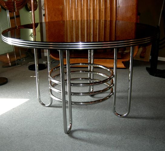 In the great Art Deco revival of the 1970's, few were more successful than the company Jazz. Located in Los Angeles' Design Center, they produced seating remniscent of Donald Deskey, and ironwork in the style of Frank Lloyd Wright. This dining set