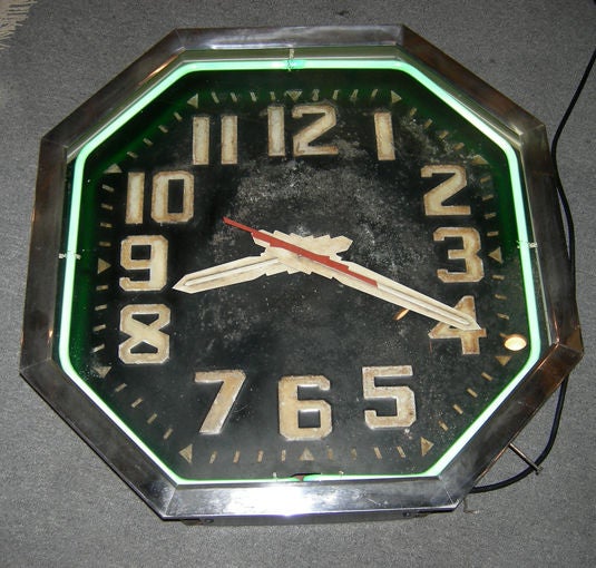 After seeing so many repainted and reproduced neon clocks, it's really a treat to find such a fine original example.This beauty was produced in the 1930's by the Say-It-In Neon clock company of Buffalo, N. Y. It is the more unusual octagon shape,