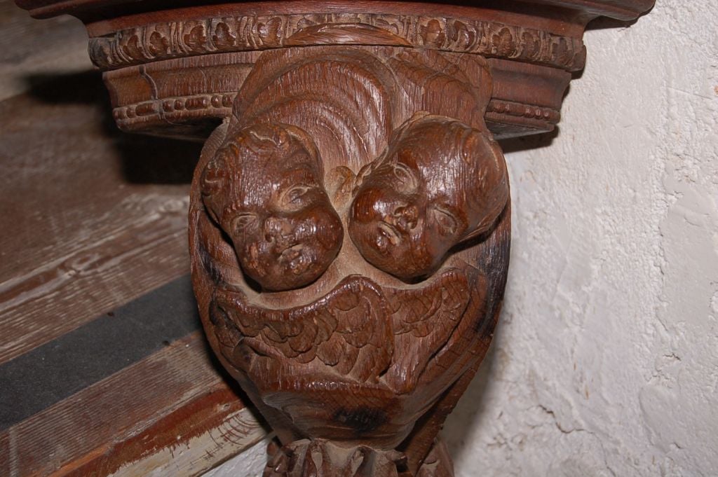 Early 1700's French oak bracket carved wood with cherubs.