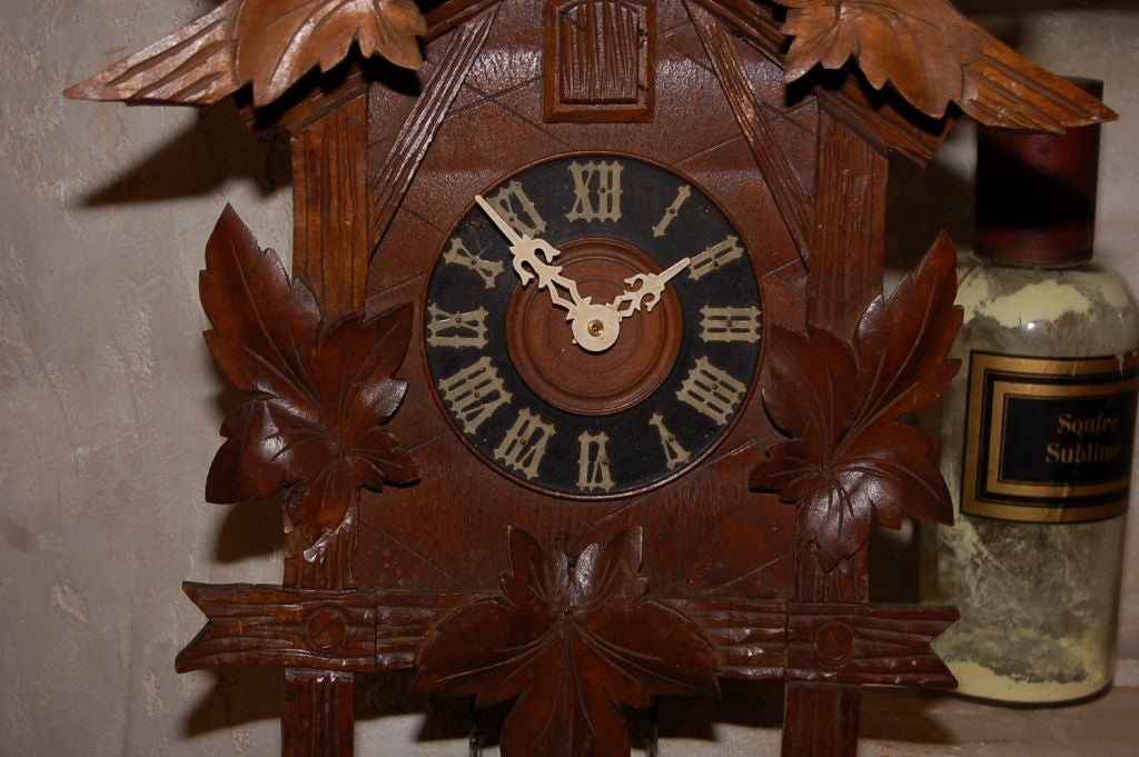Early 1900's Cuckoo Clock <br />
<br />
14''w x 21''h x 7''d