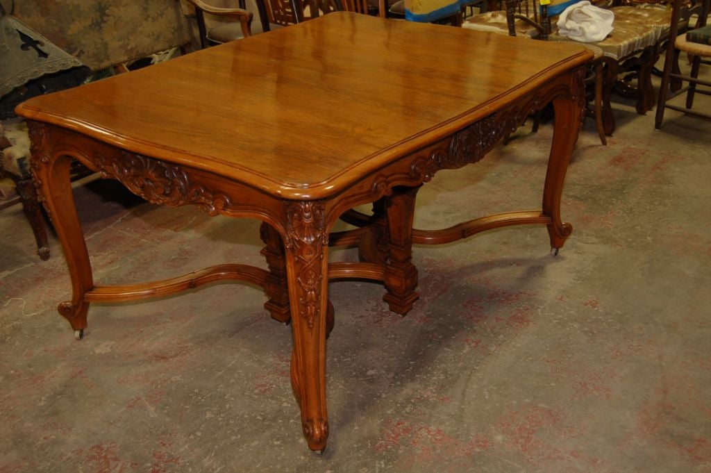 19th century walnut Italian dining table extends from the center.
Measures: Extends to 9.5''.