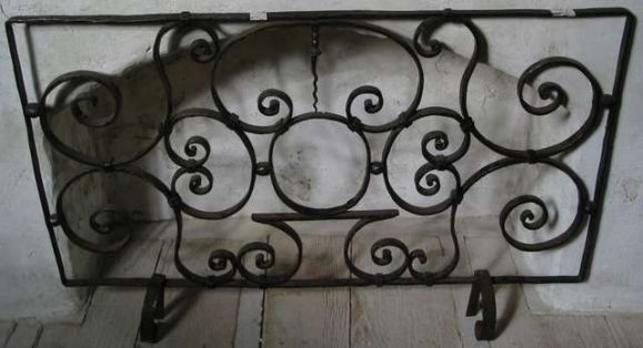 18th century hand-wrought iron part of balcony, French. 

39" H X 25.5" with legs added later can be used as a fire screen.

(Also: Balconies, grille, railing).
can be hung as a decorative piece