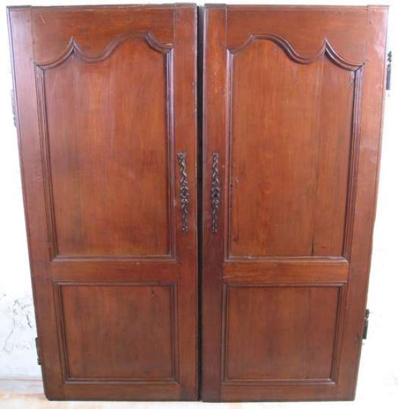 Pair of 19th century French fruitwood doors. Measures: 55'' H X 46' W.