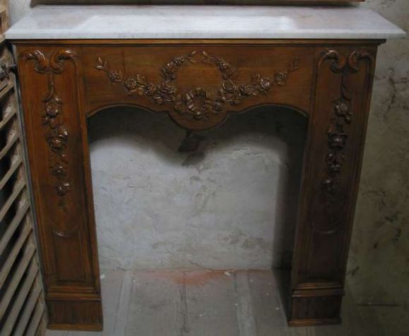 19th century French chestnut carved wood mantel and trumeau mirror (trumeau and fireplace has been cut down). Trumeau 50'' H x 42'' W, mantel 43'' W x 41.5' H x 14''D. Will sell separately.
 