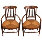 Pair Early 1900
s Rush Seat Arm Chairs