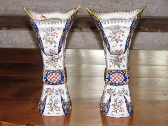 Pair of 19th century French Rouen Faience vases,
 
Measures: 13''; H x 9'' W x 7.5'' D.
