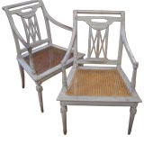 Pair of Directoire cane seat painted fauteuils.