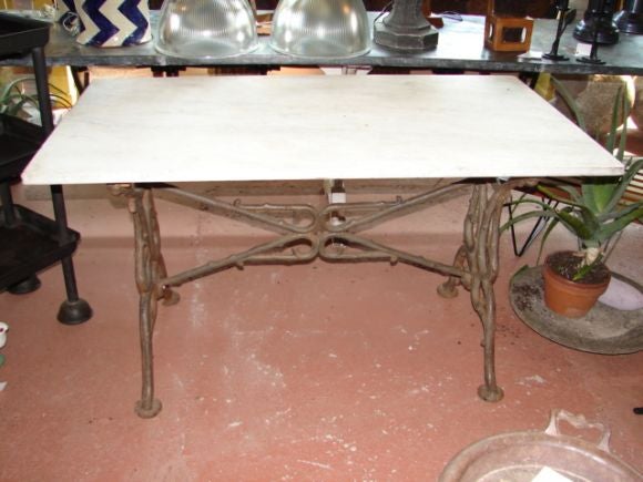 Marble top table with cast iron base