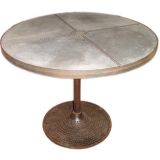 Pedestal table with studded zinc top