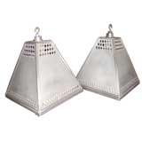Pair of pierced aluminium light fixtures
