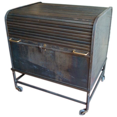 Steel roll top filing cabinet on castors