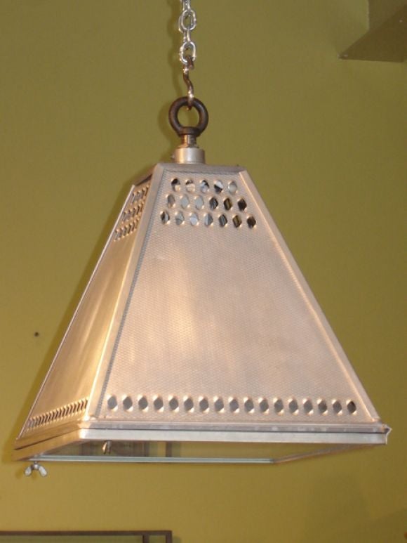 Pair of piered stainless steel industrial hanging light fixtures from France, with glass covers, newly wired with edison sockets.