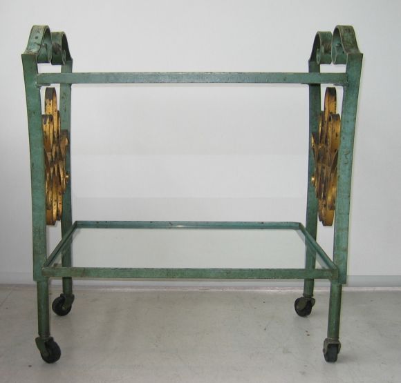 Beautiful tea cart in patinaed green and gilt iron.