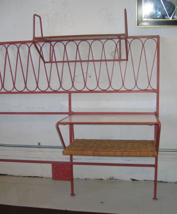 Wonderful full-size headboard by Salterini. The side table and bookshelf hang on the frame.  Milk glass and wicker shelves.  The one pictured is painted a coral color.  The actual one for sale is black.