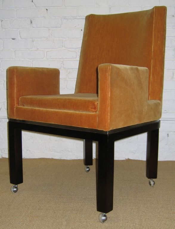 Wonderfully sculptural and amply proportioned dining chairs.  Dark walnut wood base with chrome trim between base and upholstered seat.  Loose seat cushion.  Original wool mohair. 