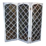 A large French screen with antiqued mirrors
