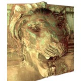 Large, powerful copper sculpture of a lion