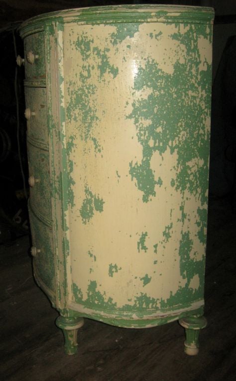 American Charming turn of the century oval chest of drawers