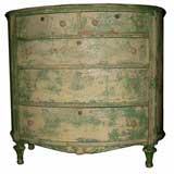 Charming turn of the century oval chest of drawers