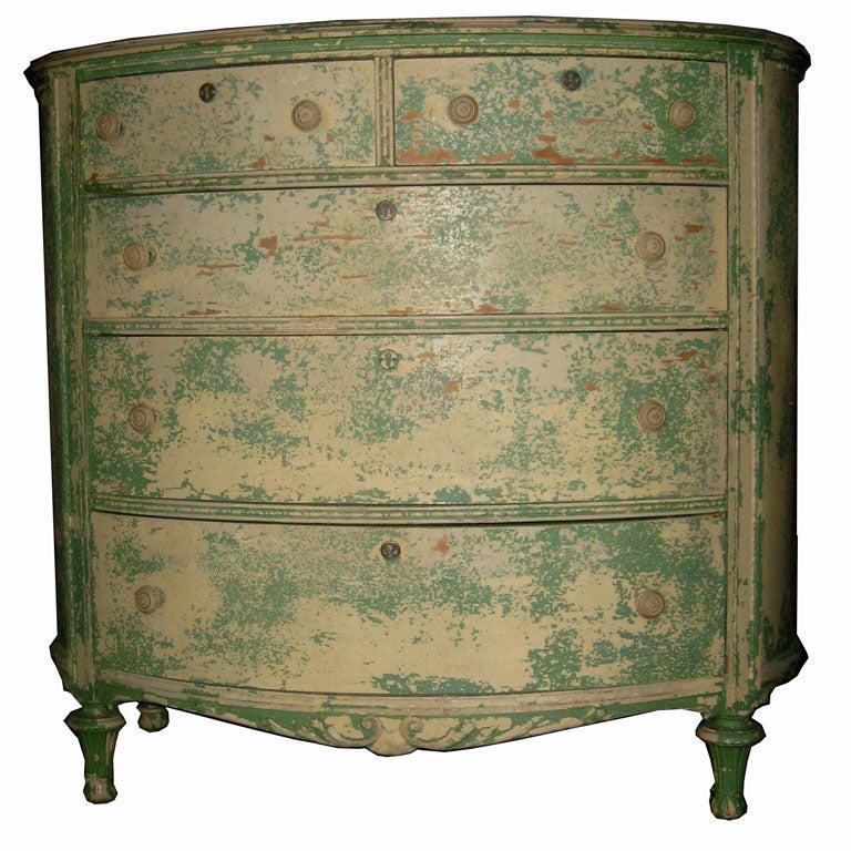 Charming turn of the century oval chest of drawers