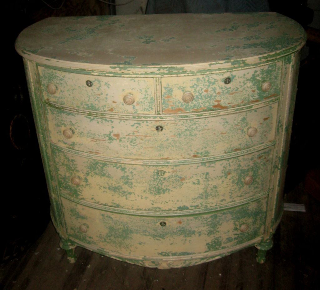 The oval shape and age signs give great carachter and charm to this turn of the century dresser.Five drawers.  Great craftmanship. original label from R J Horner & Co