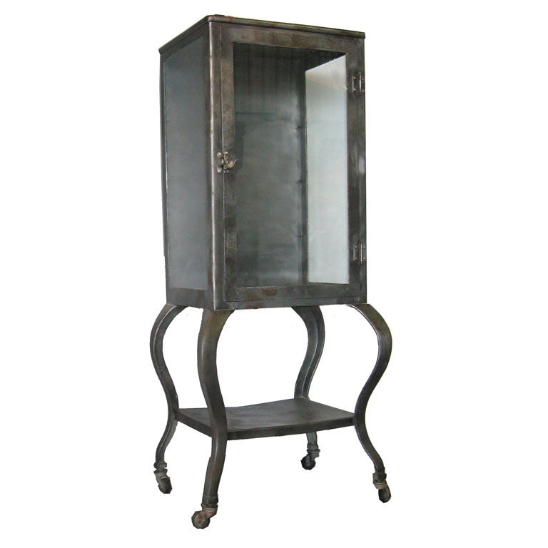 Antique medical cabinet on wheels
