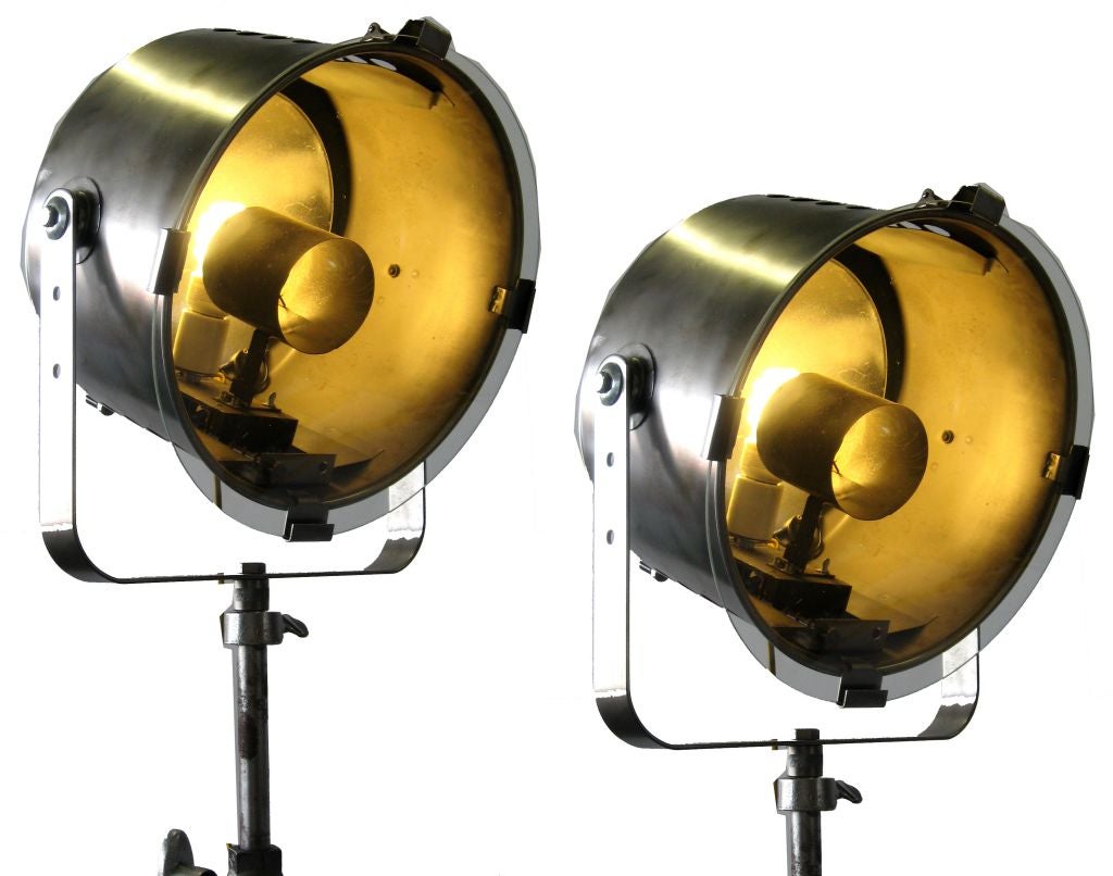 Pair of cool metal stage light rewired to house regular bulbs. Adjustable height.