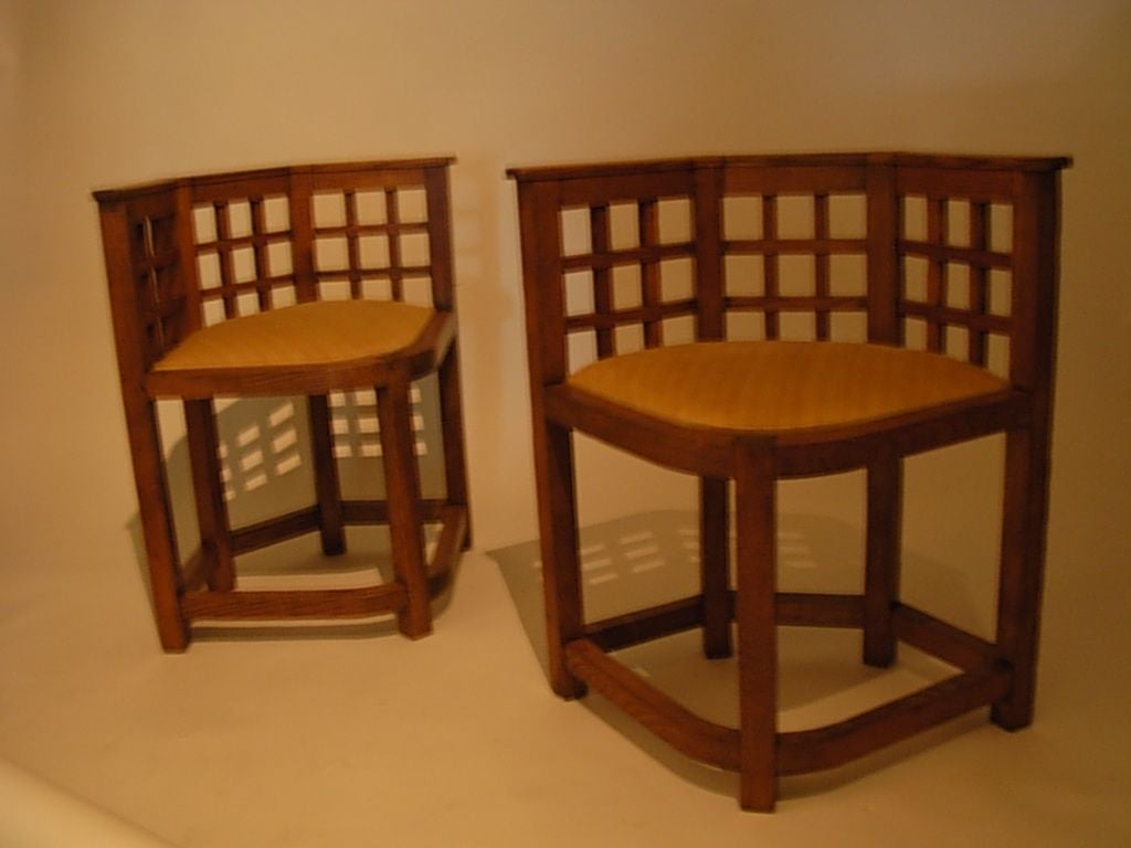 Corner chair with square grit (lattice) back and trapezoidal seat over five legs. DIMENSIONS: 25 in width X 18 in. deep X 27 ¾ high.                                                         Seat:  22 in width X 15 in. deep X 17 ½ high