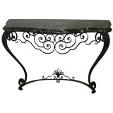Hand hammered French iron console table with green marble top.
