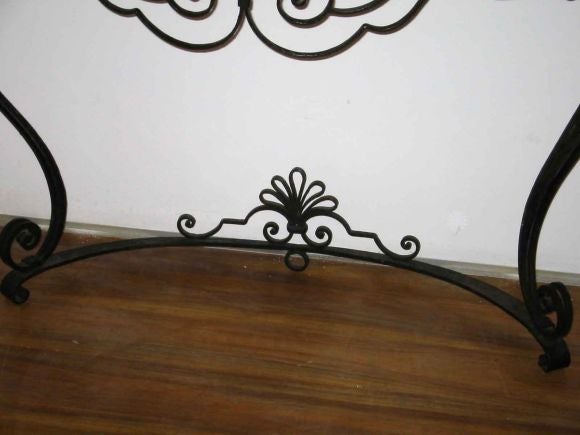 Hand hammered French iron console table with green marble top.