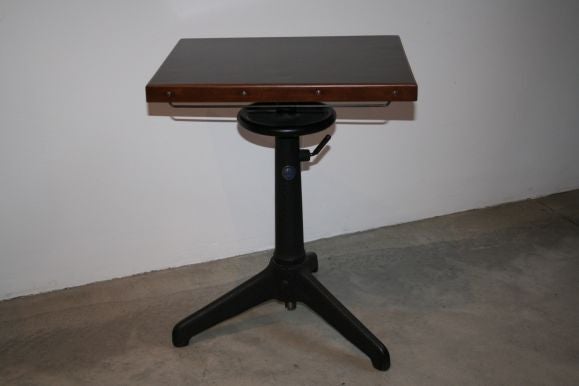 Pair of 20's industrial rotating end tables, heavy cast iron base and wooden top