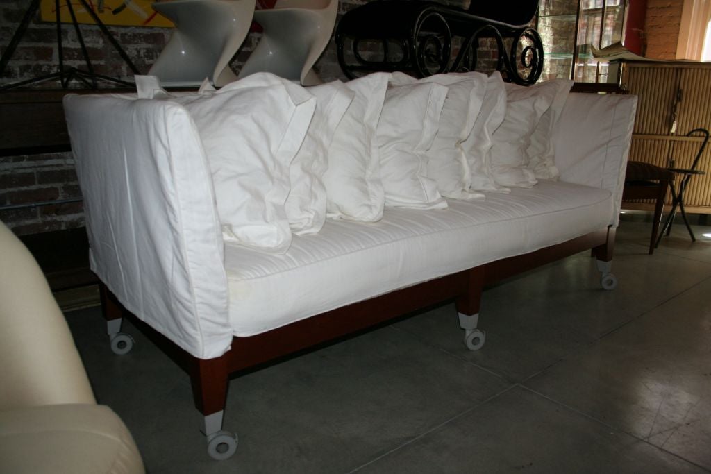 Phillip Starck Neoz sofa with 8 pillows, upholstered with ivory white linen; extra slip covers and pillows available. The sofa forms a set with a Phillip Starck high-back sofa featured on 1stdibs reference #U0709118175343, but can be sold seperately.