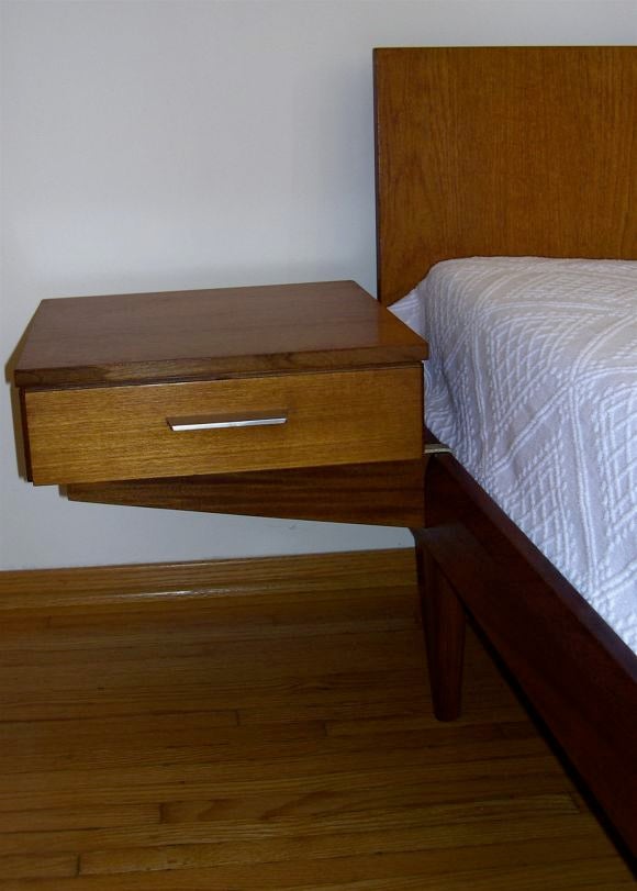 bed with attached nightstands