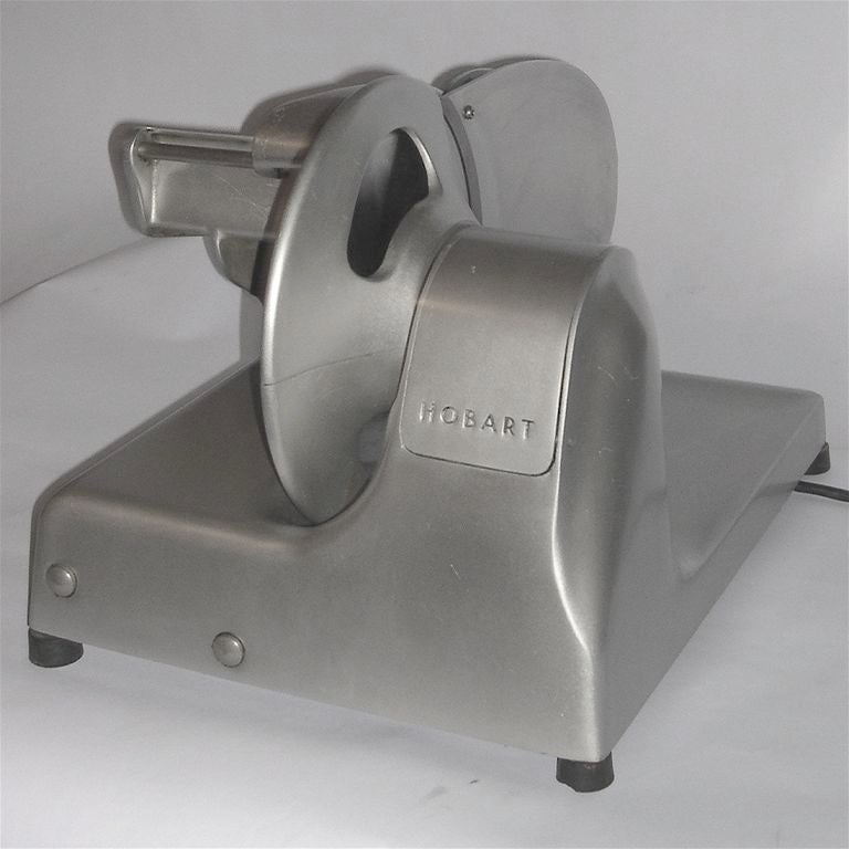The Streamliner meat slicer is considered to be one of the icons of American modern design. Not only is this example in great visual condition, it is a fully functional electric meat slicer. It even has it's original blade sharpener. Perfect for